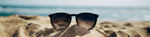 RayBan sunglasses on beach - Revive Laser